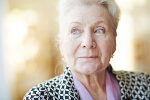 older person glancing to the left.
